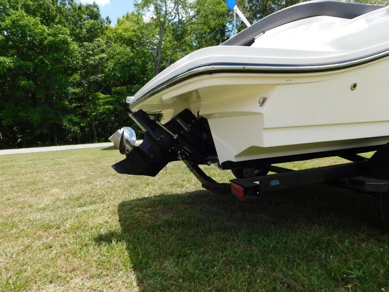 Slide: The Image of 2015 Sea Ray 19 SPX boat rear view on grass, showcasing propeller and hull design. - 23