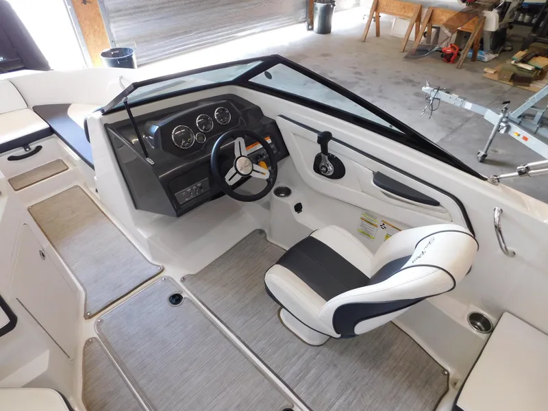 Slide: The Image of 2015 Sea Ray 19 SPX boat interior with steering wheel and dashboard. - 8