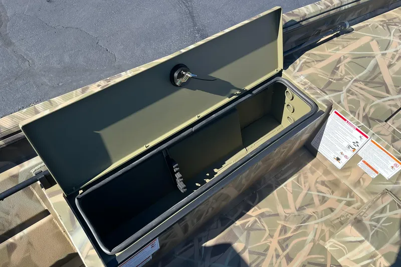 Slide: The Image of 2025 Lowe Roughneck 1760SC boat storage compartment with camouflage design. - 17