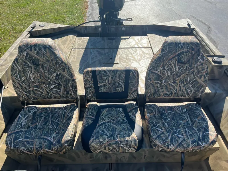 Slide: The Image of 2025 Lowe Roughneck 1760SC boat seats with camouflage pattern. - 9