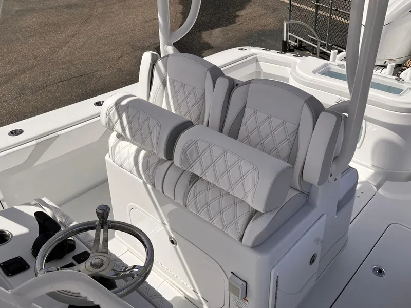 Slide: The Image of Luxurious seating on 2025 Yellowfin 32 boat with diamond-stitched upholstery and modern helm design. - 12