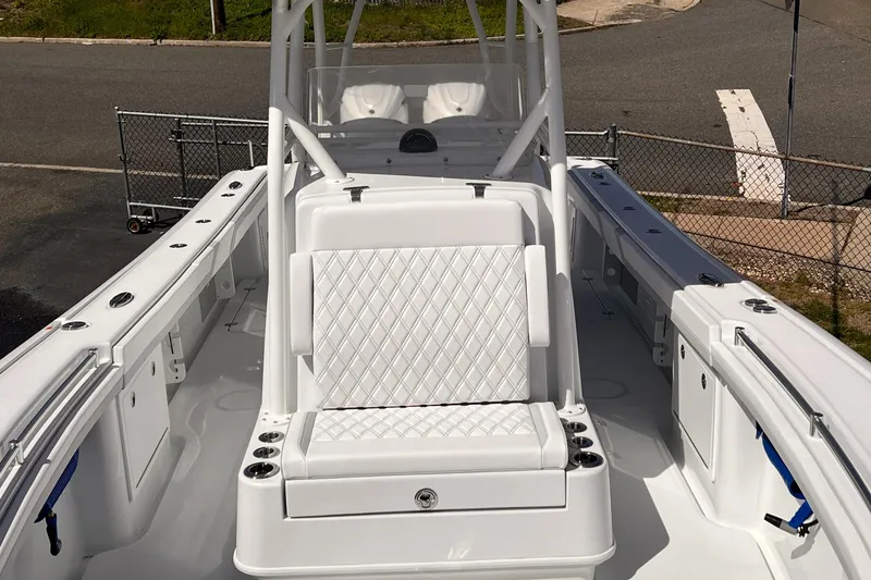 Slide: The Image of 2025 Yellowfin 32 boat with white seating and spacious deck layout. - 14