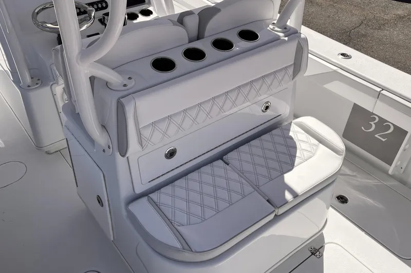 Slide: The Image of Luxurious seating on 2025 Yellowfin 32 boat with cup holders and diamond stitching. - 15