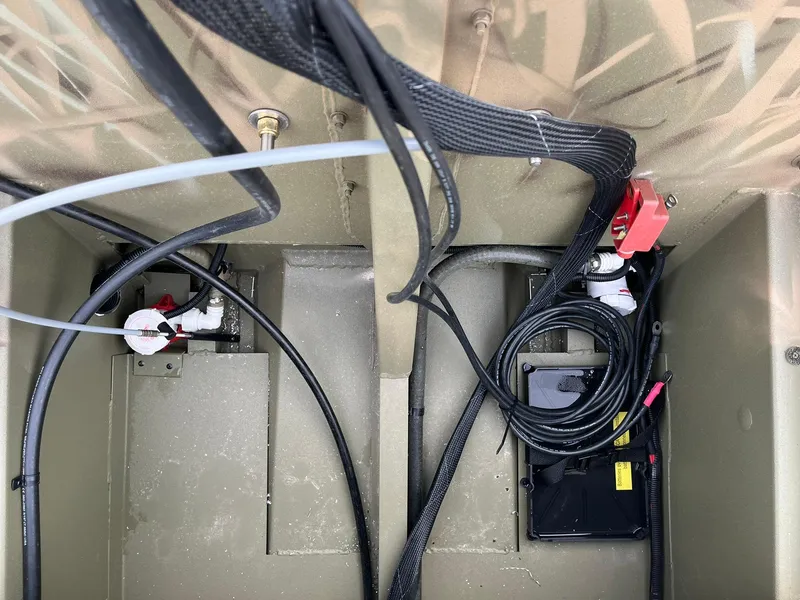 Slide: The Image of 2025 Lowe Roughneck 1860 Tunnel Jet boat interior wiring and components. - 17