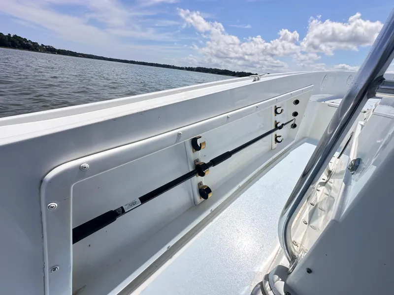 Slide: The Image of 1995 Mako 221 B Classic Center Console boat on calm water, clear sky. - 15