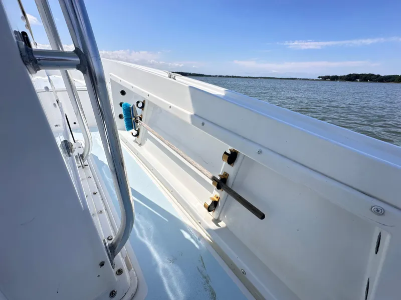 Slide: The Image of 1995 Mako 221 B Classic Center Console boat on calm water. - 16
