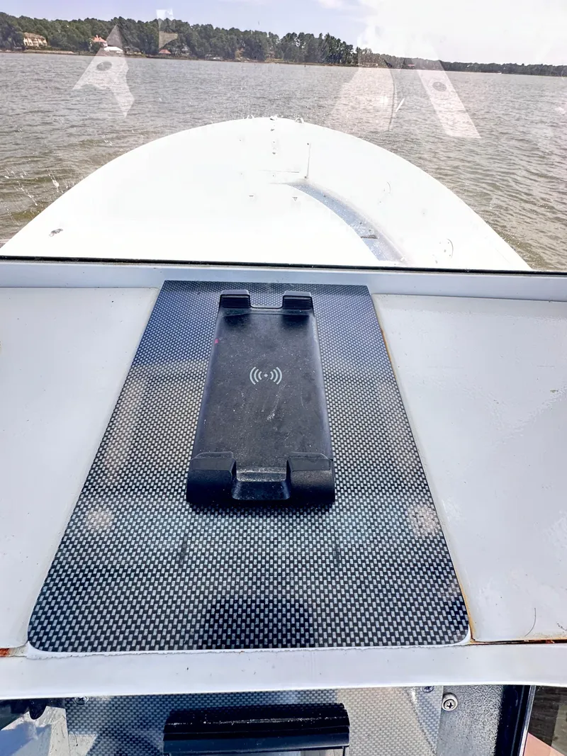 Slide: The Image of 1995 Mako 221 B Classic Center Console boat on calm water. - 17