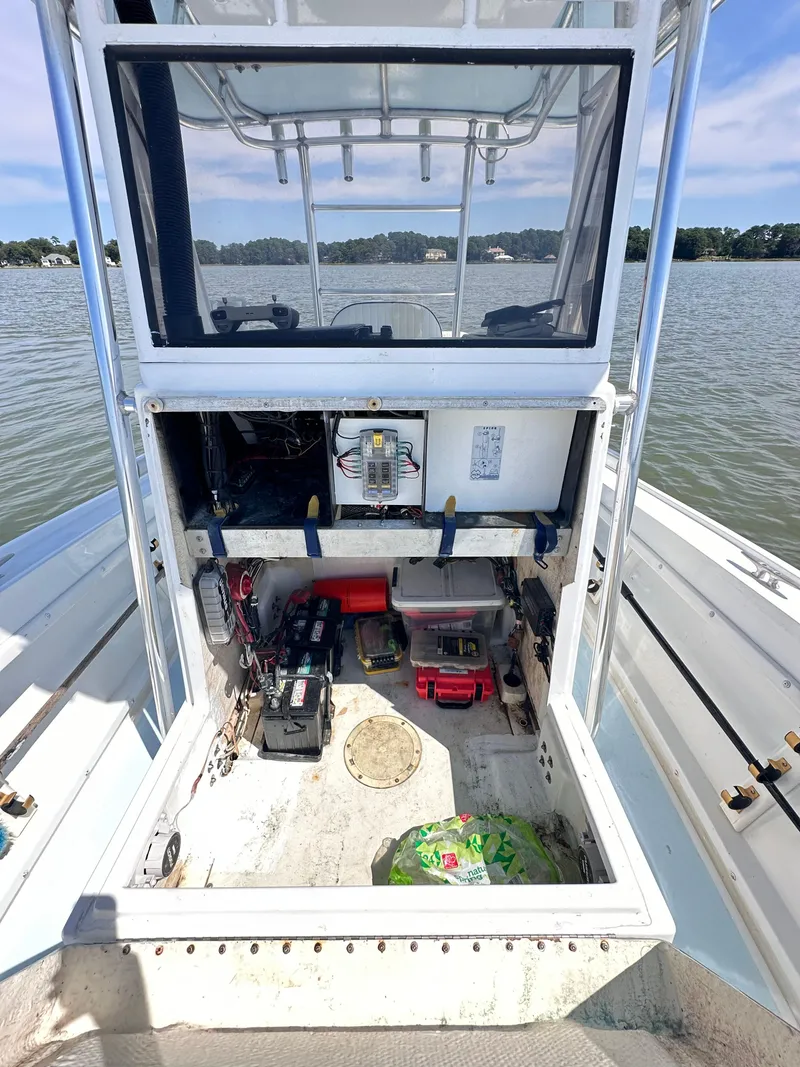 Slide: The Image of 1995 Mako 221 B Classic Center Console boat interior with storage and equipment. - 21