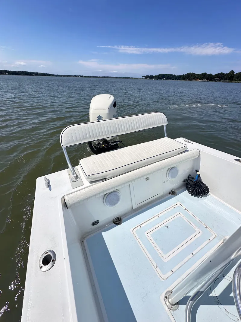Slide: The Image of 1995 Mako 221 B Classic Center Console boat on calm water. - 7