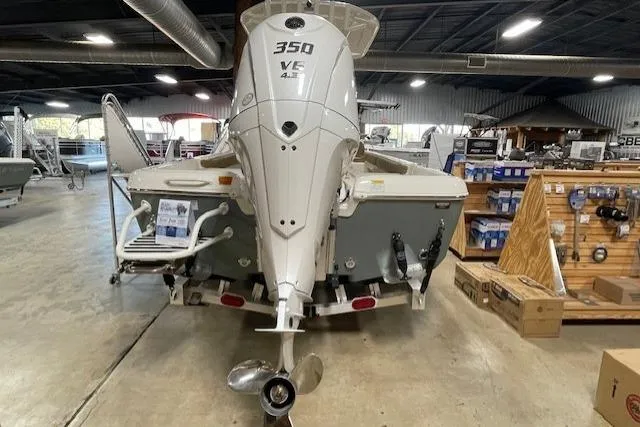 Slide: The Image of 2025 Skeeter SX2550 boat with 350 V6 engine displayed indoors. - 11