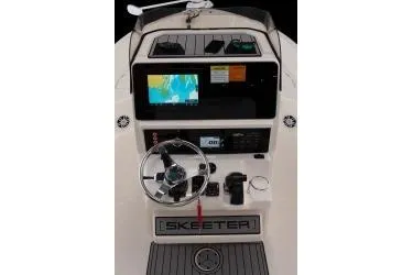 Slide: The Image of 2025 Skeeter SX2550 boat dashboard with navigation screen and controls. - 16