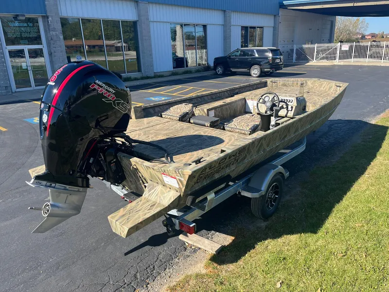 Slide: The Image of 2025 Lowe Roughneck 2070 SC boat on trailer, parked outside dealership. - 3