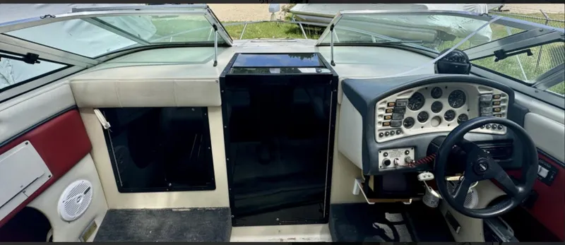 Slide: The Image of 1992 Crownline 210 CCR boat dashboard with steering wheel and instrument panel. - 6