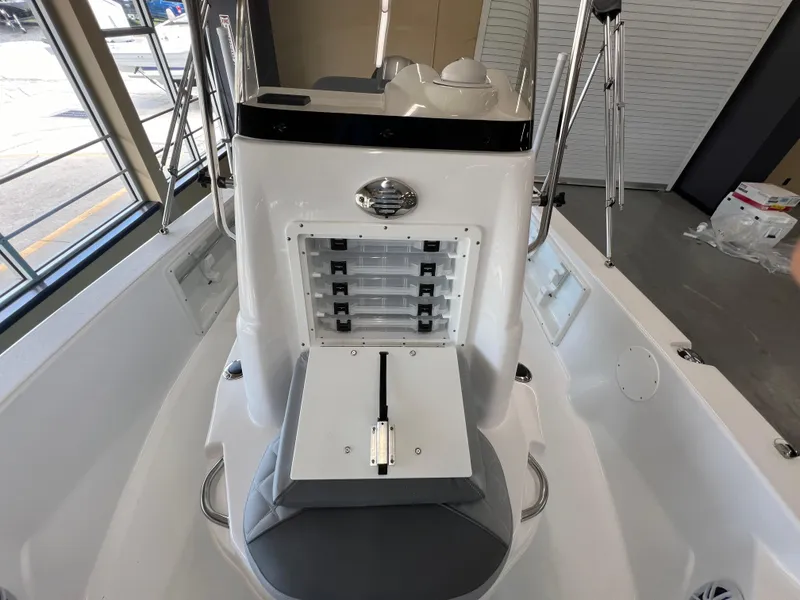 Slide: The Image of 2025 NauticStar 194 Bay boat interior with storage compartments and seating. - 22