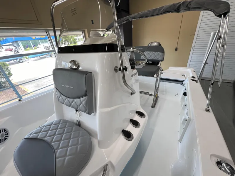 Slide: The Image of 2025 NauticStar 194 Bay boat interior with sleek seating and modern design. - 23