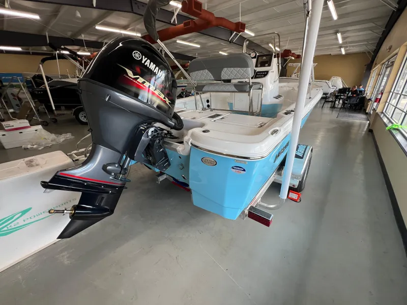 Slide: The Image of 2025 NauticStar 194 Bay boat with Yamaha outboard motor in showroom. - 4