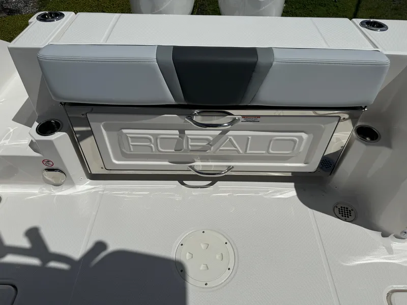 Slide: The Image of 2025 Robalo R270 Center Console boat seat with integrated storage compartment. - 11
