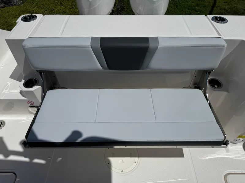 Slide: The Image of 2025 Robalo R270 Center Console boat seat, featuring a sleek, foldable design. - 12