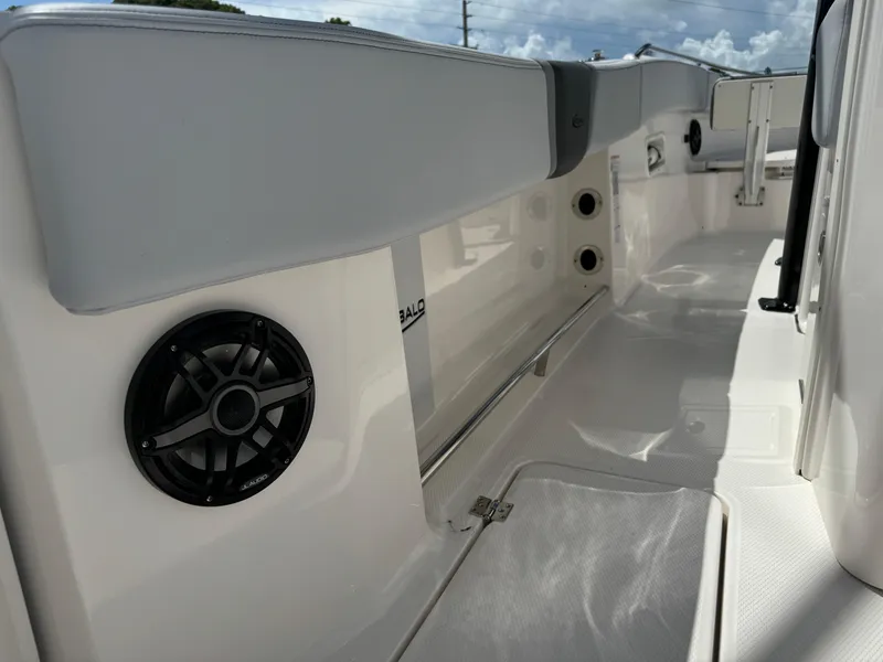Slide: The Image of 2025 Robalo R270 Center Console interior with sleek seating and built-in speakers. - 16