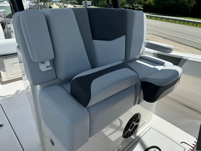 Slide: The Image of 2025 Robalo R270 Center Console boat seat with gray and black upholstery. - 19
