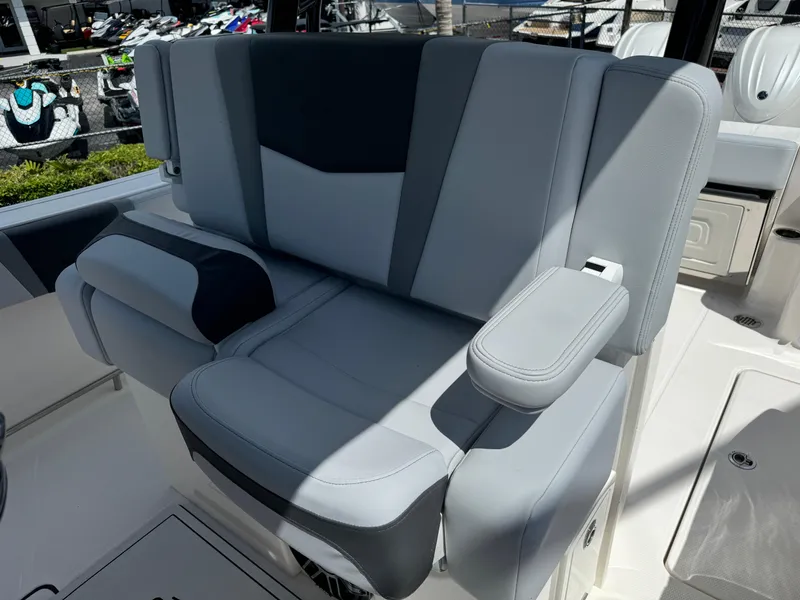 Slide: The Image of 2025 Robalo R270 Center Console boat seat with gray and black upholstery. - 20