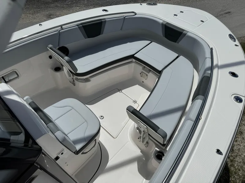 Slide: The Image of 2025 Robalo R270 Center Console boat with spacious seating and modern design. - 23