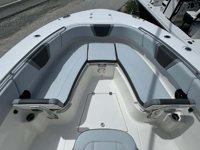 Slide: The Image of 2025 Robalo R270 Center Console boat with spacious seating and sleek design. - 25