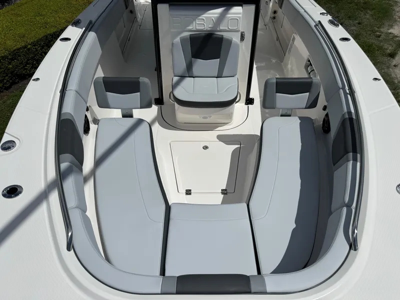 Slide: The Image of 2025 Robalo R270 Center Console boat interior with spacious seating and modern design. - 26