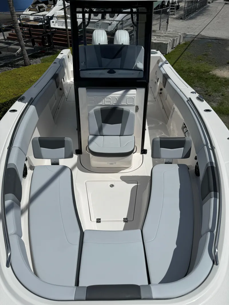 Slide: The Image of 2025 Robalo R270 Center Console boat with spacious seating and modern design. - 27