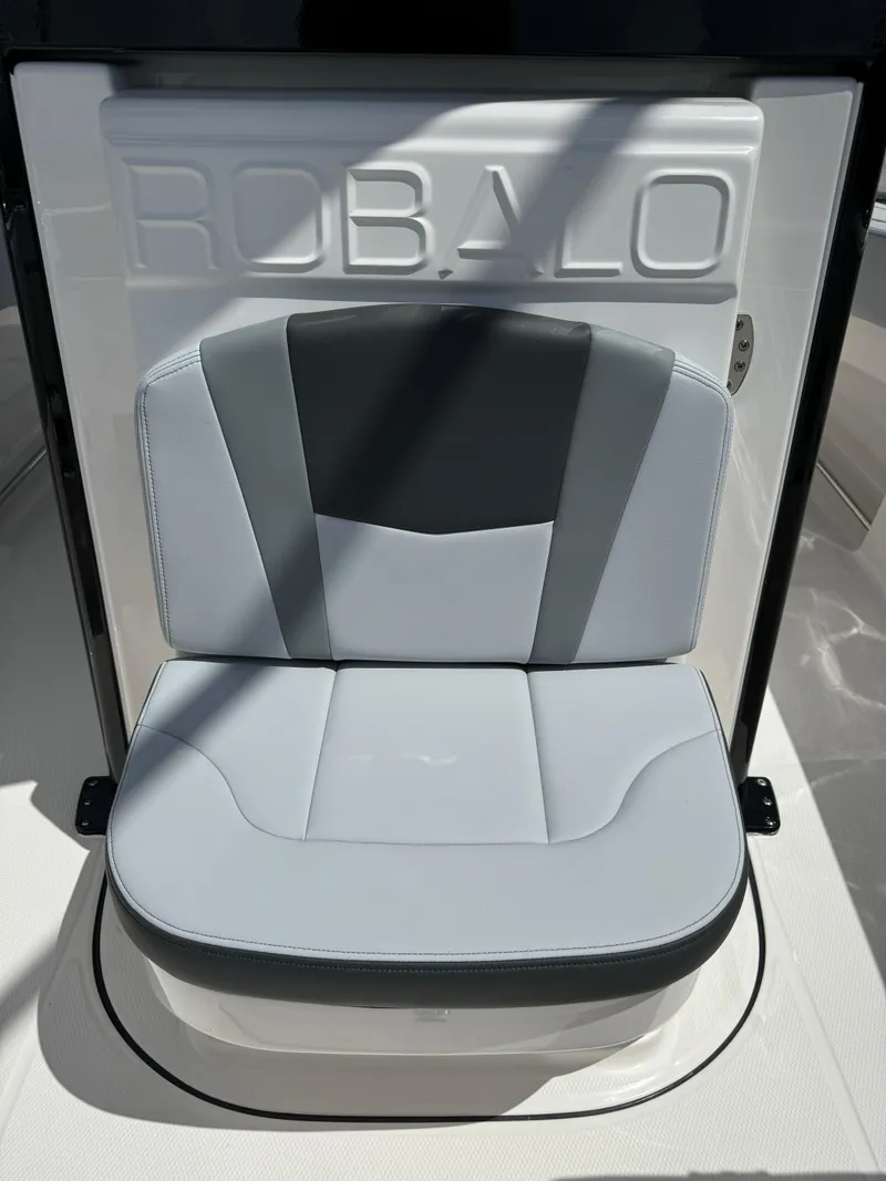 Slide: The Image of 2025 Robalo R270 Center Console seat with sleek gray and white design. - 29