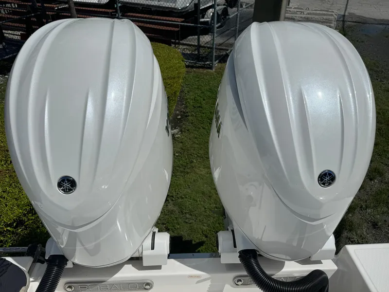 Slide: The Image of Twin Yamaha outboard engines on a 2025 Robalo R270 Center Console boat. - 5