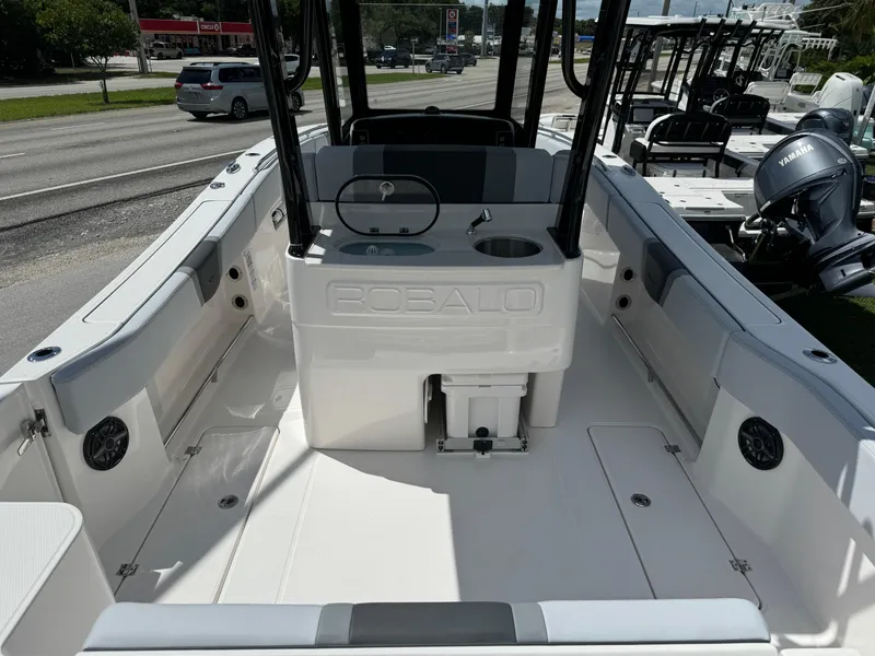 Slide: The Image of 2025 Robalo R270 Center Console boat interior with seating and storage compartments. - 7