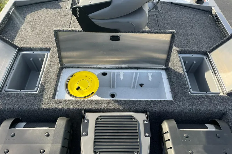 Slide: The Image of 2025 Lowe Stinger 175C boat interior with storage compartments and seating. - 17