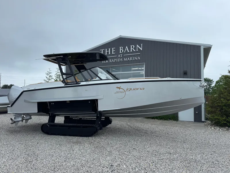 Slide: The Image of 2025 Iguana Bow Rider boat with tracks at Elk Rapids Marina. - 1