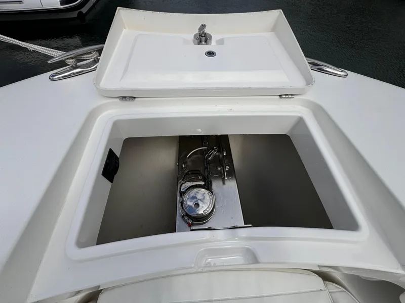 Slide: The Image of 2018 Regulator 28 boat storage compartment with sink and faucet. - 12