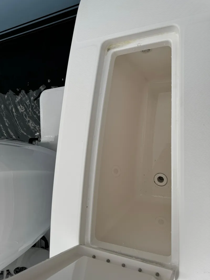 Slide: The Image of 2018 Regulator 28 boat storage compartment, open and empty. - 21