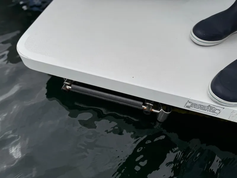 Slide: The Image of Regulator 28 boat platform with boots, 2018 model, on water. - 23