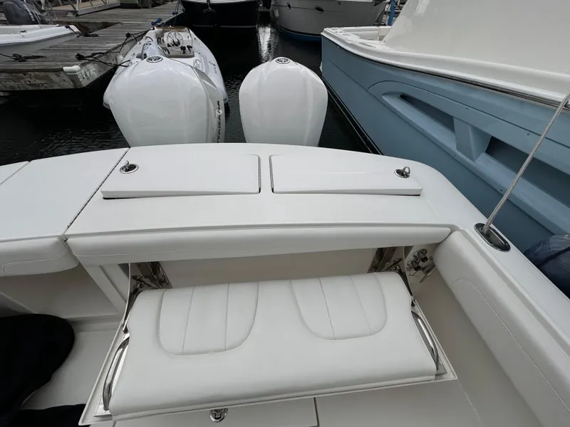 Slide: The Image of 2018 Regulator 28 boat with dual engines and white seating. - 24
