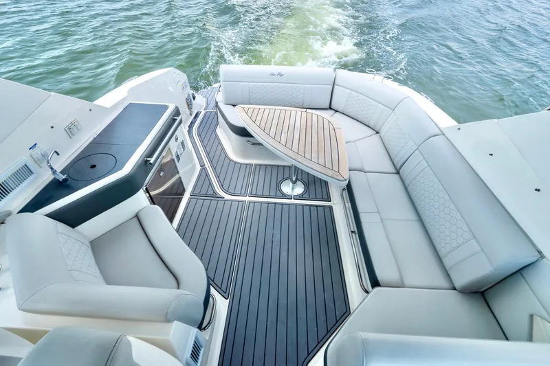 Slide: The Image of 2020 Sea Ray Sundancer 320 yacht interior with elegant seating and sleek design. - 11