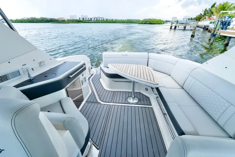 Slide: The Image of Luxurious 2020 Sea Ray Sundancer 320 yacht interior with elegant seating and scenic water view. - 13