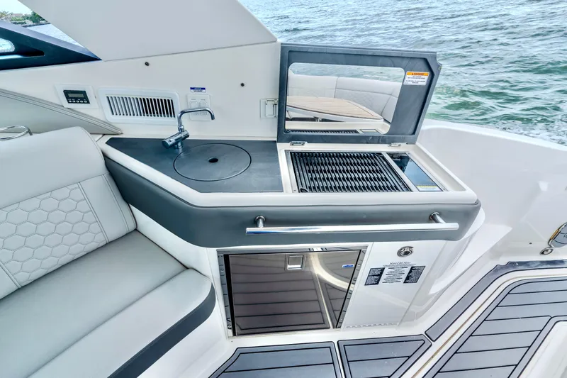 Slide: The Image of 2020 Sea Ray Sundancer 320 yacht with outdoor kitchenette and grill. - 15