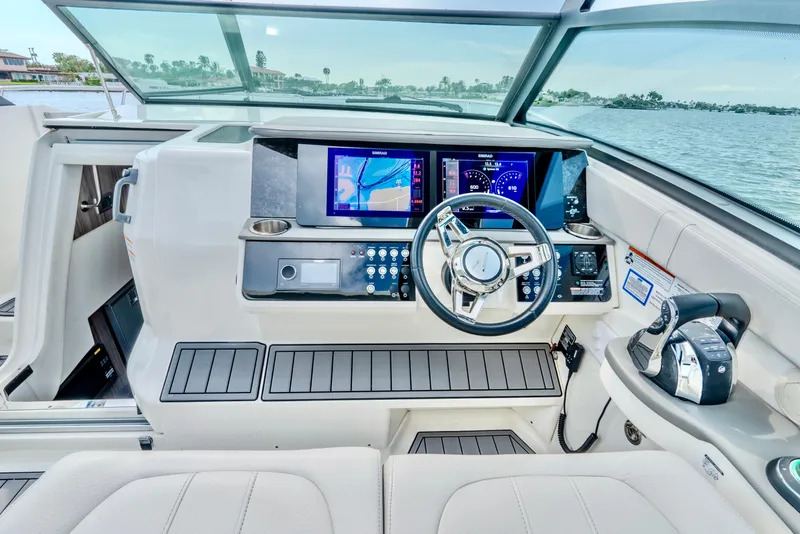 Slide: The Image of 2020 Sea Ray Sundancer 320 helm with advanced navigation system and luxurious interior. - 16