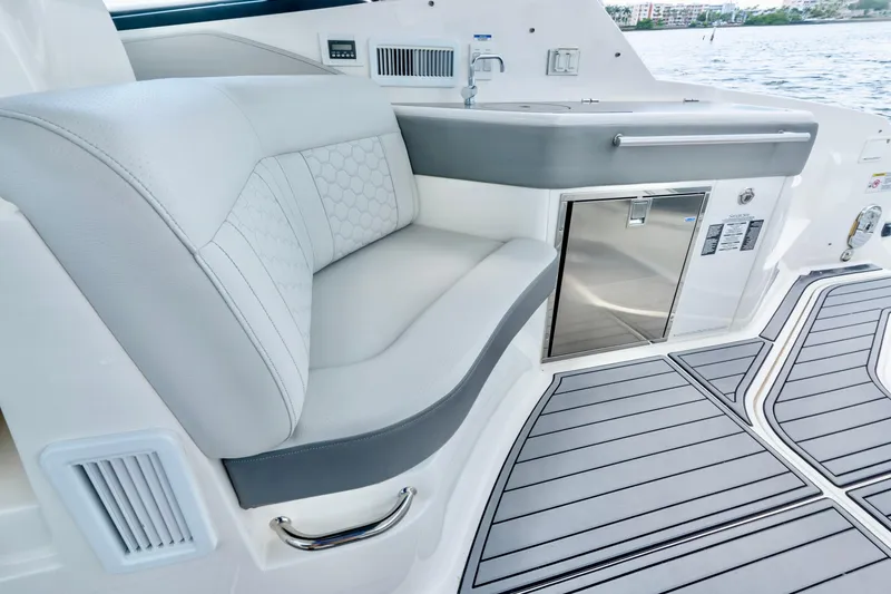 Slide: The Image of 2020 Sea Ray Sundancer 320 interior with sleek seating and modern amenities. - 18