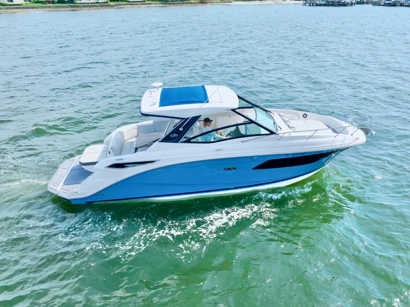 Slide: The Image of 2020 Sea Ray Sundancer 320 cruising on open water, side view. - 3