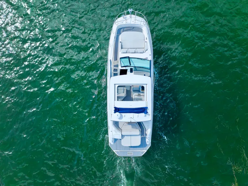 Slide: The Image of Aerial view of 2020 Sea Ray Sundancer 320 yacht on open water. - 7