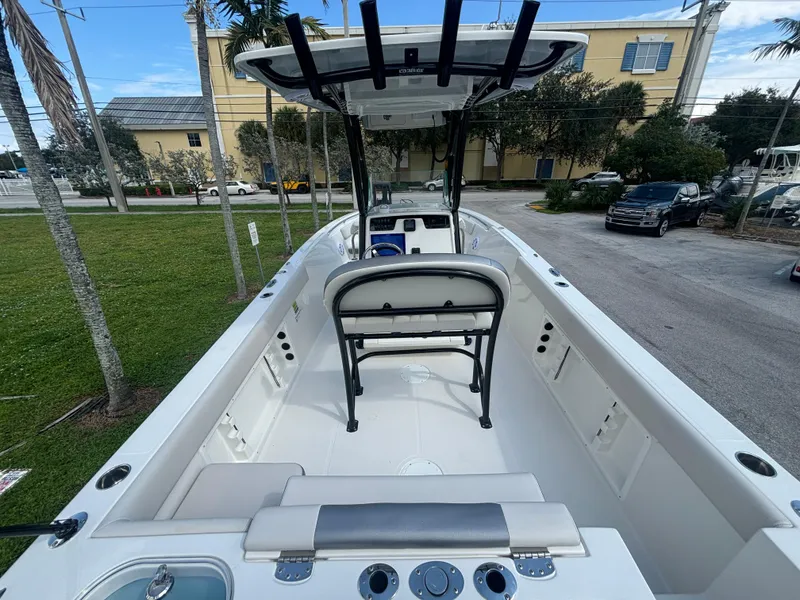 Slide: The Image of 2025 Sailfish 241 CC boat interior with seating and control panel. - 13