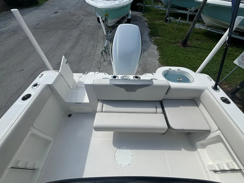 Slide: The Image of 2025 Sailfish 241 CC boat interior with seating and storage compartments. - 20