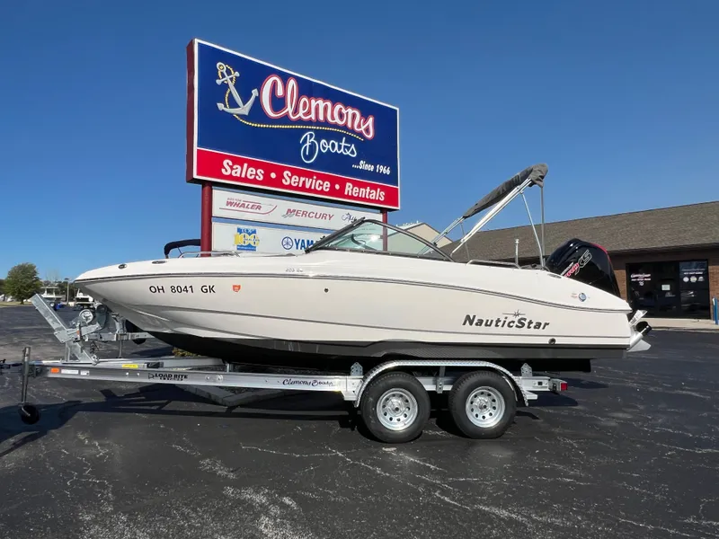 The Image of 2023 NauticStar 203 DC boat on trailer at Clemons Boats dealership. - 0