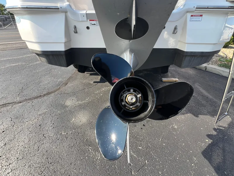 Slide: The Image of Propeller of 2023 NauticStar 203 DC boat on asphalt surface. - 5