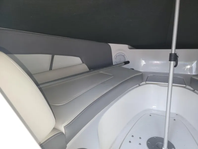 Slide: The Image of Interior of 2011 Sea Ray 240 Sundeck boat, featuring seating and storage area. - 10